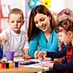 Group Of Elementary Age Children In Art Class With Teacher Group Of Elementary Age Children In Art Class With Teacher